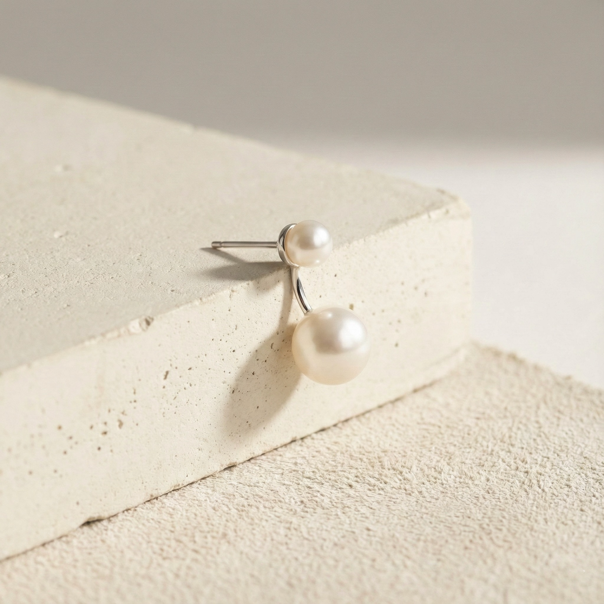 Caellia freshwater double pearl stud earrings in 925 sterling silver.