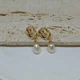 Gold-plated earrings with a vintage design, featuring a rose and a dangling freshwater pearl.