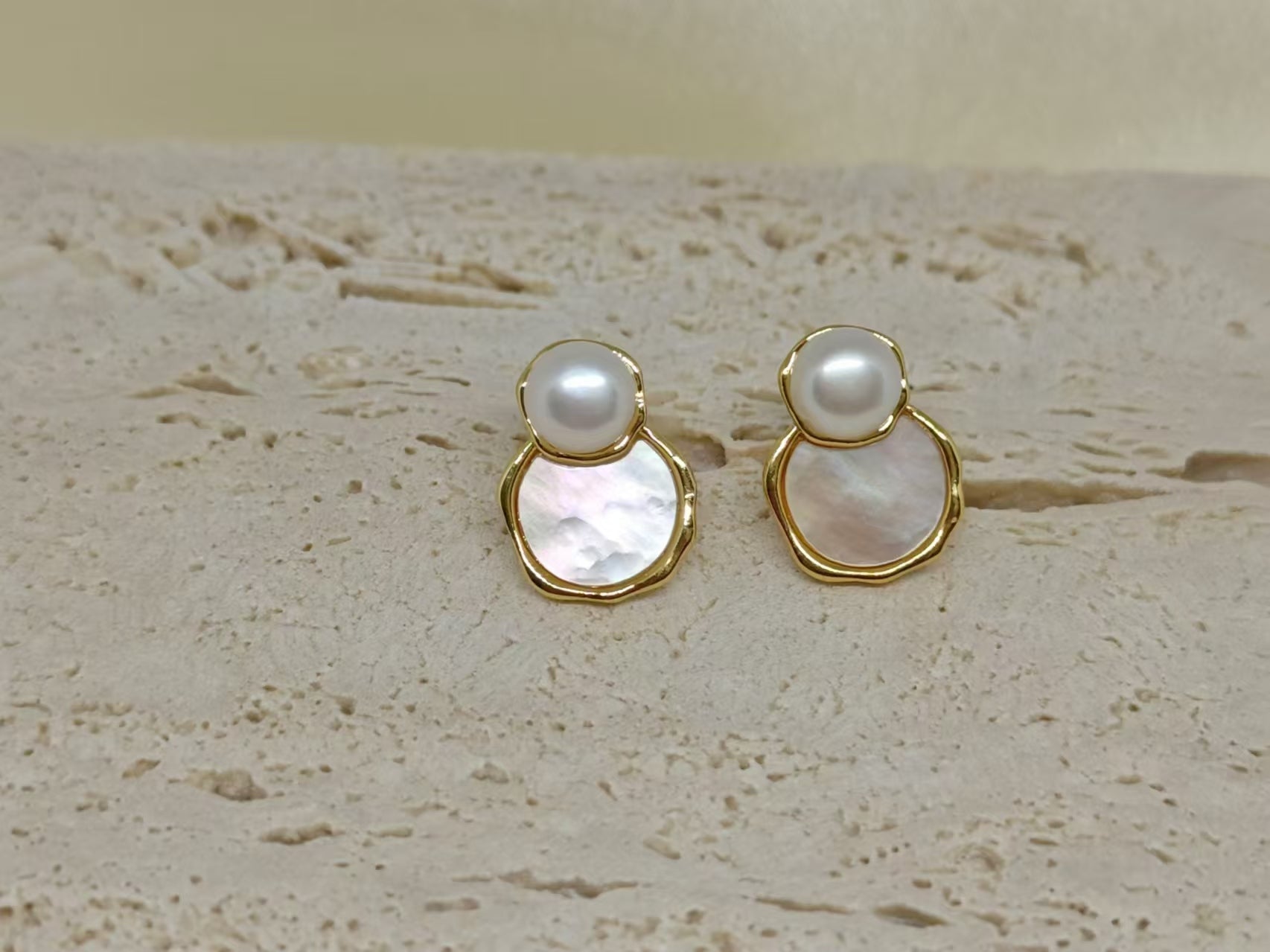 Freshwater pearl and fritillaria earrings with gold-toned settings.
