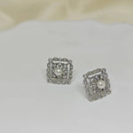 Two silver quadrate vintage stud earrings with freshwater pearls and diamonds.