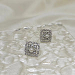 Two silver quadrate vintage stud earrings with freshwater pearls and diamonds.