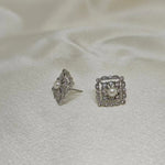 Two silver quadrate vintage stud earrings with freshwater pearls and diamonds.