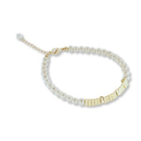 A freshwater pearl bracelet with gold-plated square beads and a lobster clasp.
