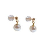 Small round pearl dangle earrings with gold-plated studs and clear backings.