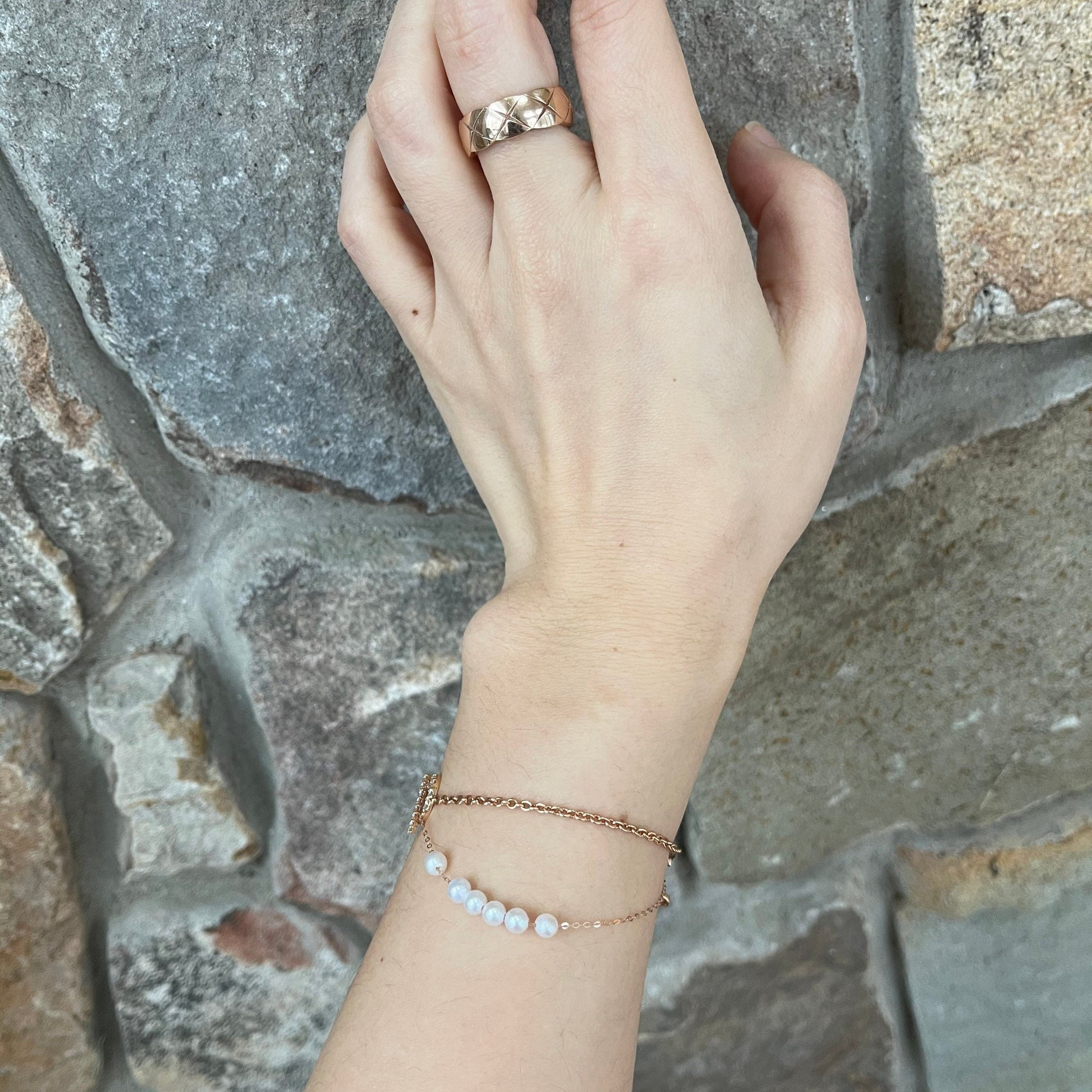 A CAELLIA dainty gold-plated chain bracelet featuring a row of natural freshwater pearls.