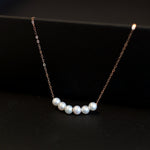 CAELLIA dainty gold-plated chain bracelet featuring five natural freshwater pearls.