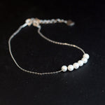 CAELLIA dainty freshwater pearl bracelet featuring five pearls on a delicate silver-tone chain.