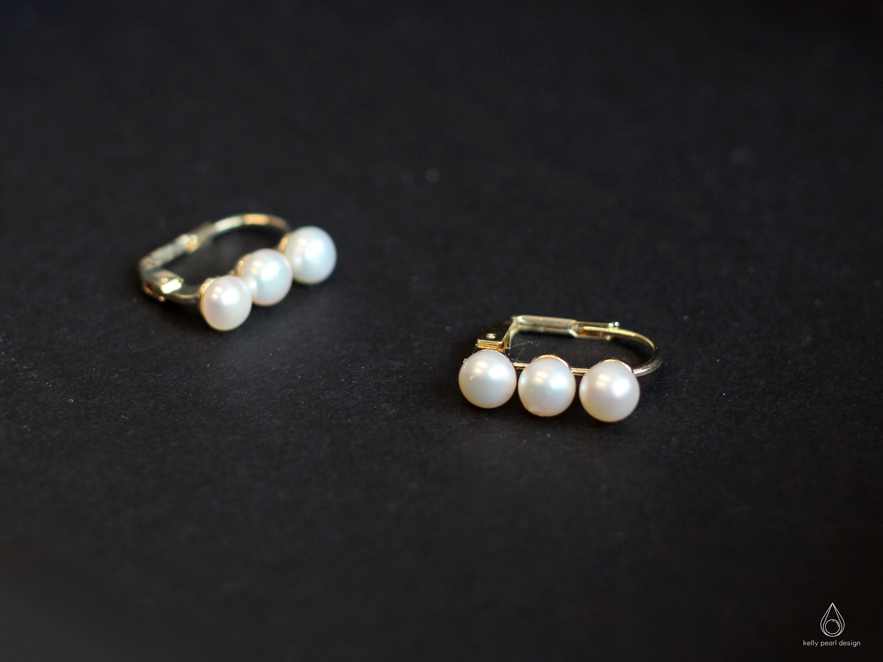 Caellia 14K gold plated hoop earrings featuring three lustrous freshwater pearls.