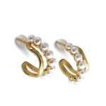 Caellia 14K gold filled hoop earrings featuring a row of lustrous freshwater pearls.