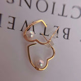 Caellia rose gold sterling silver heart hoop earrings featuring a single freshwater pearl.