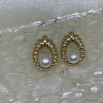 CAELLIA vintage style water drop shaped earrings featuring a central freshwater pearl.