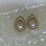 CAELLIA vintage style water drop shaped earrings featuring a central freshwater pearl.