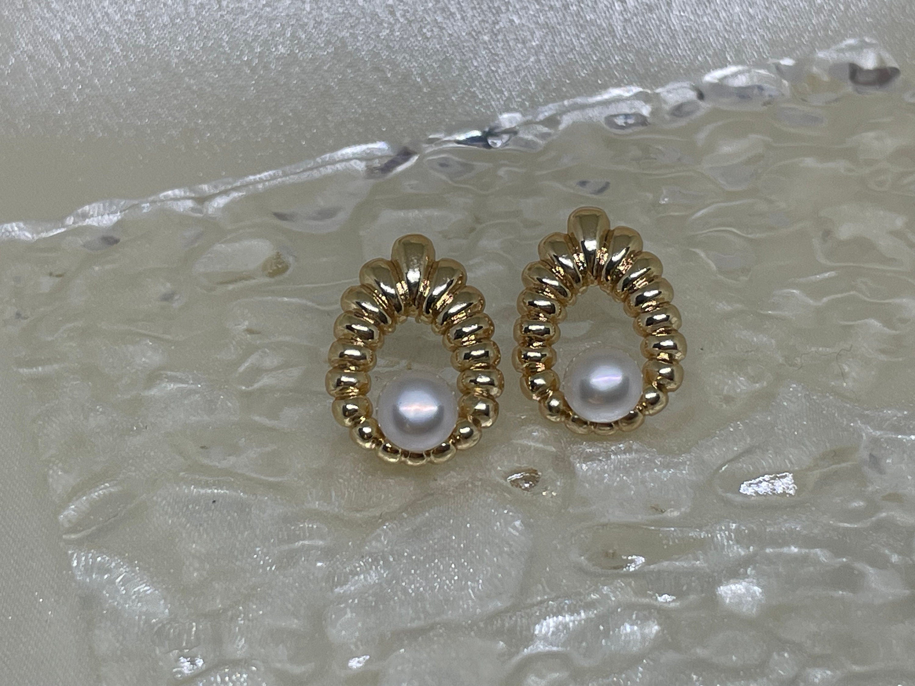 CAELLIA vintage style water drop shaped earrings featuring a central freshwater pearl.