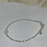 CAELLIA sterling silver bracelet with small metallic beads and a single freshwater pearl.