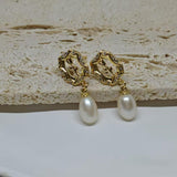 CAELLIA gold plated earrings featuring a vintage rose design and a dangling freshwater pearl.