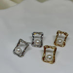 CAELLIA freshwater pearl square stud earrings in gold and silver on a white surface.