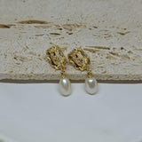CAELLIA gold plated earrings featuring a vintage rose design and a dangling freshwater pearl.