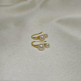 Caellia 18K gold plated stud earrings featuring two delicate freshwater pearls.