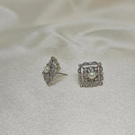 CAELLIA sterling silver square stud earrings featuring a central freshwater pearl and diamond accents.