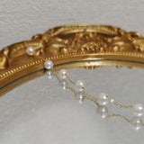 CAELLIA freshwater pearl bracelet featuring seven pearls on a delicate gold-plated silver chain.