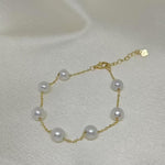 CAELLIA freshwater pearl bracelet featuring seven pearls on a gold-plated sterling silver chain.