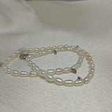 CAELLIA double wrapped freshwater pearl bracelet with gold plated sterling silver accents.