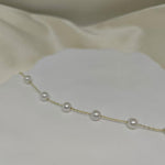 CAELLIA freshwater pearl bracelet featuring seven pearls on a delicate gold-plated silver chain.
