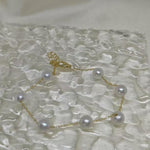 CAELLIA freshwater pearl bracelet featuring seven pearls on a gold plated sterling silver chain.