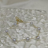 CAELLIA freshwater pearl bracelet featuring seven pearls on a gold plated sterling silver chain.