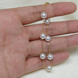 CAELLIA freshwater pearl bracelet featuring seven pearls on a gold-plated sterling silver chain.