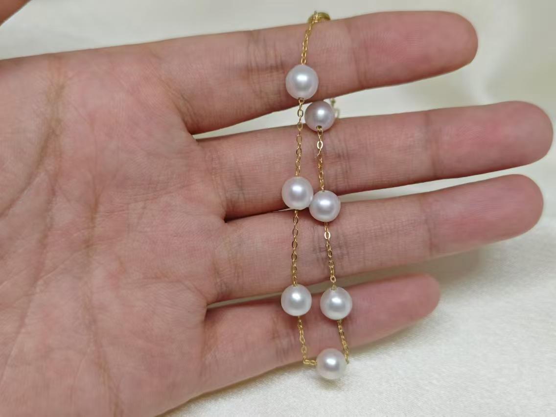 CAELLIA freshwater pearl bracelet featuring seven pearls on a gold-plated sterling silver chain.