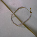 CAELLIA freshwater pearl bracelet with gold plated sterling silver and an adjustable chain.