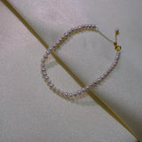 CAELLIA freshwater pearl bracelet with gold plated sterling silver and an adjustable chain.
