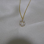 CAELLIA gold plated necklace featuring a delicate flower pendant made of five freshwater pearls.