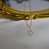 CAELLIA gold plated necklace featuring a delicate flower pendant made of small freshwater pearls.