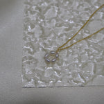 CAELLIA gold plated necklace featuring a delicate flower pendant made of small freshwater pearls.