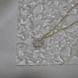 CAELLIA gold plated necklace featuring a delicate flower pendant made of small freshwater pearls.