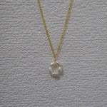 CAELLIA gold plated necklace featuring a minimalist flower pendant made of freshwater pearls.