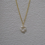 CAELLIA gold plated necklace featuring a minimalist flower pendant made of freshwater pearls.