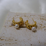 Caellia 14K gold huggie hoop earrings featuring a textured finish and a freshwater pearl.
