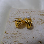 Caellia 14K gold huggie hoop earrings featuring a vintage braided design and freshwater pearls.