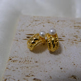 Caellia 14K gold huggie hoop earrings featuring a vintage braided design and freshwater pearls.
