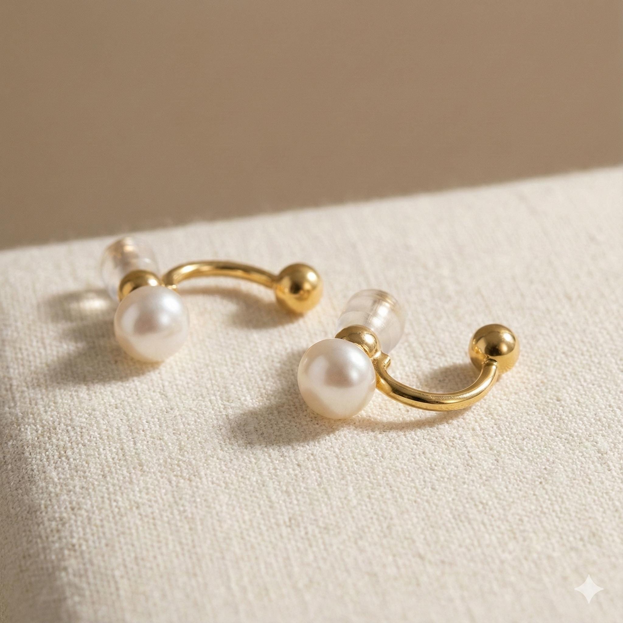 Caellia 14K gold double-sided stud earrings featuring lustrous freshwater pearls.