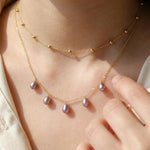 A CAELLIA dainty lavender freshwater pearl necklace on a 14K gold plated chain.