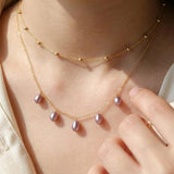 A CAELLIA dainty lavender freshwater pearl necklace on a 14K gold plated chain.