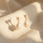 Caellia 14K gold plated sterling silver earrings featuring teardrop freshwater pearls.