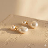 Caellia 14K gold plated sterling silver earrings featuring teardrop freshwater pearls.