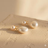 Close up of gold teardrop freshwater pearl earrings for sensitive ears