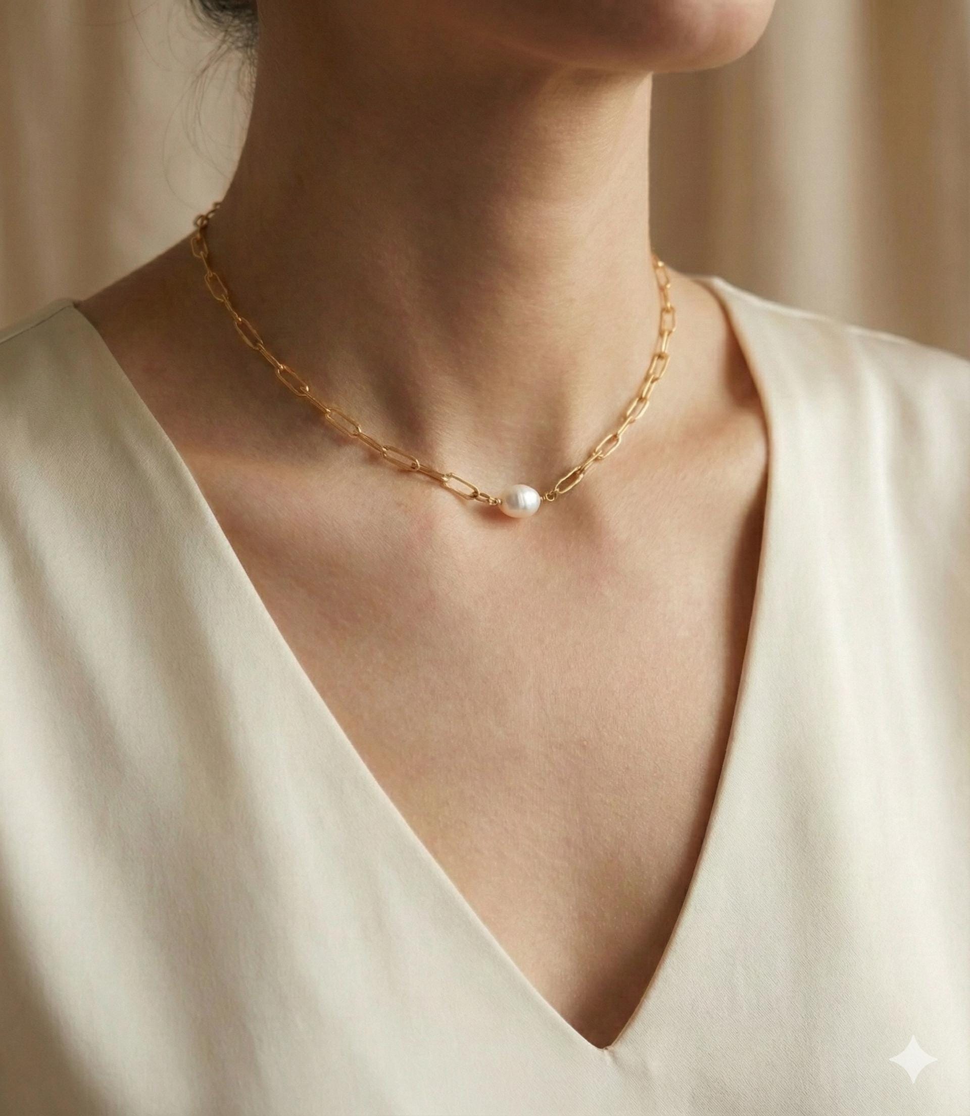 A Caellia 18K gold paperclip chain necklace featuring a single baroque freshwater pearl.