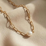 Caellia 18K gold paperclip chain necklace featuring a single baroque freshwater pearl.
